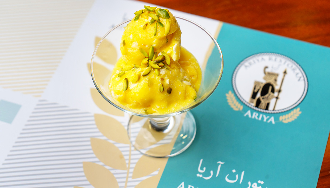 Experience the sophisticated taste of Persian Saffron Ice Cream, crafted with care at Ariya Restaurant. Made with premium ingredients and traditional recipes, this dessert is a true Persian delight.